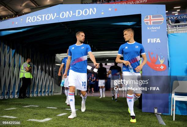 Gylfi Sigurdsson of Iceland and Alfred Finnbogason of Iceland walk out for the warm up prior to the 2018 FIFA World Cup Russia group D match between...