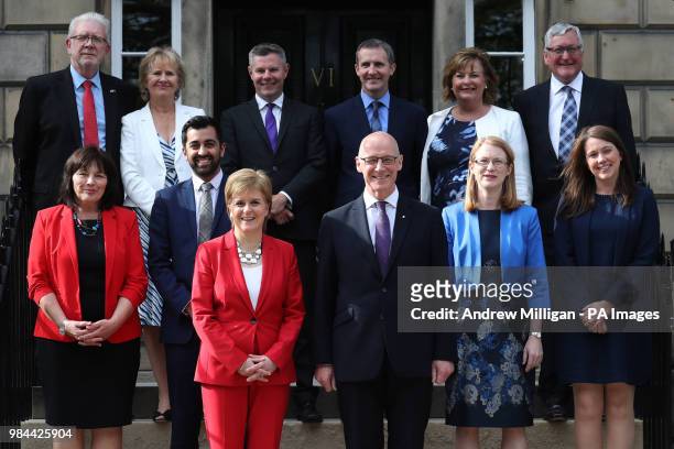 First Minister of Scotland, Nicola Sturgeon and Deputy First Minister John Swinney , with Mike Russell, Roseanna Cunningham, Derek Mackay, Michael...