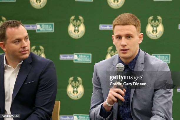 Milwaukee Bucks general manager Jon Horst and head coach Mike Budenholzer introduce Donte DiVincenzo during a press conference on June 25, 2018 at...
