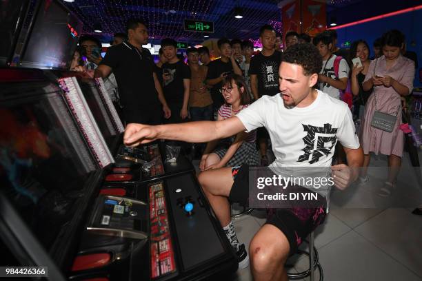 Player Klay Thompson of the Golden State Warriors play vedio games with fans on June 26, 2018 in Zhengzhou, China.