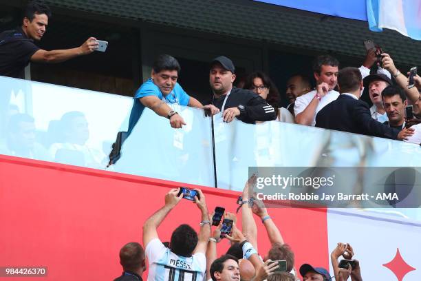 Argentina legend Diego Maradona points as fans react prior to the 2018 FIFA World Cup Russia group D match between Nigeria and Argentina at Saint...