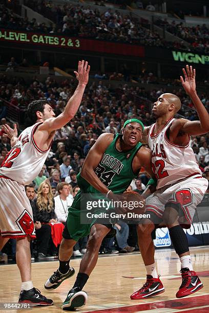 Paul Pierce of the Boston Celtics drives to the basket against Kirk hinrich and Taj Gibson of the Chicago Bulls on April 13, 2010 at the United...