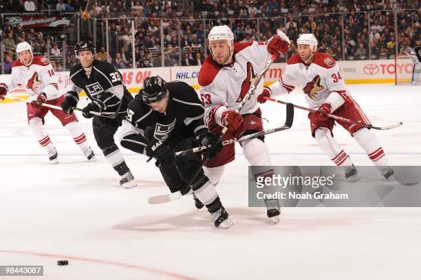 Brad Richardson of the Los Angeles Kings battles for position against Derek Morris of the Phoenix Coyotes on April 8, 2010 at Staples Center in Los...