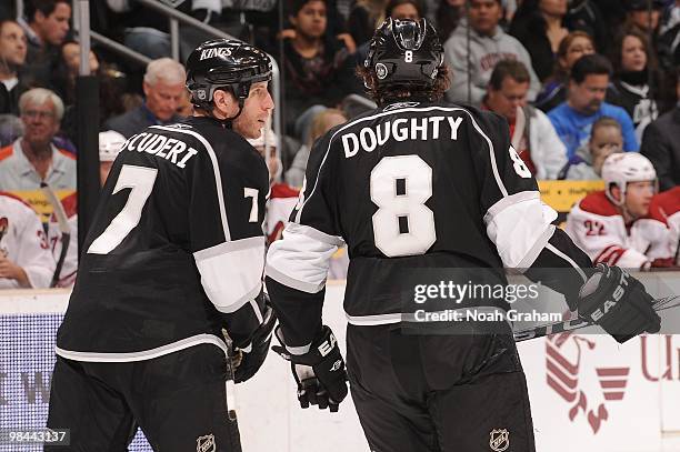 Rob Scuderi and Drew Doughty of the Los Angeles Kings talk on the ice during a break in the action against the Phoenix Coyotes on April 8, 2010 at...