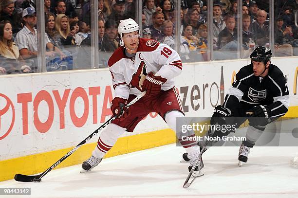 Shane Doan of the Phoenix Coyotes skates with the puck against Rob Scuderi of the Los Angeles Kings on April 8, 2010 at Staples Center in Los...