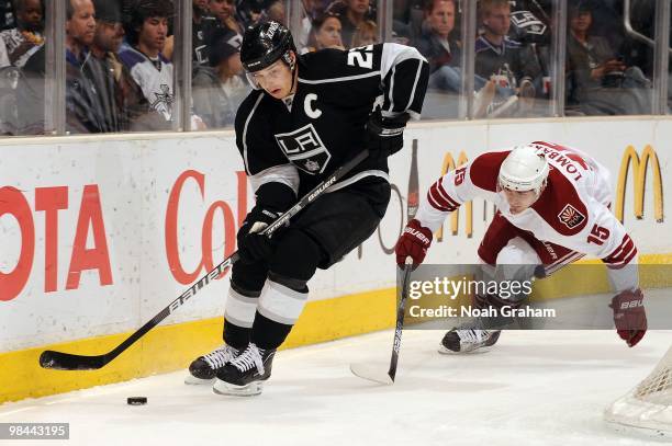 Dustin Brown of the Los Angeles Kings skates with the puck against Matthew Lombardi of the Phoenix Coyotes on April 8, 2010 at Staples Center in Los...