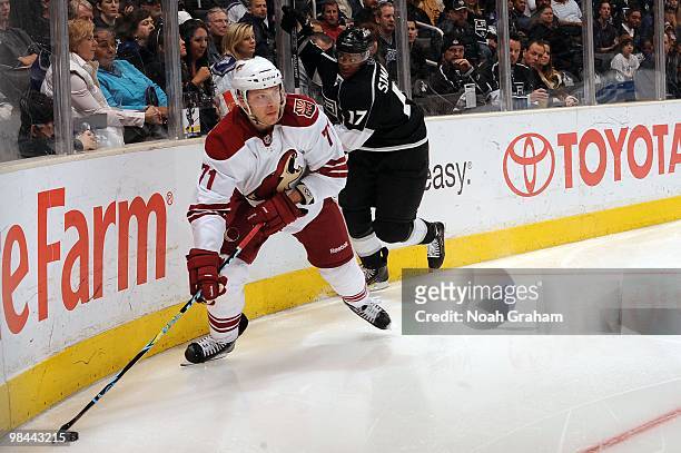 Petteri Nokelainen of the Phoenix Coyotes skates with the puck against Wayne Simmonds of the Los Angeles Kings on April 8, 2010 at Staples Center in...