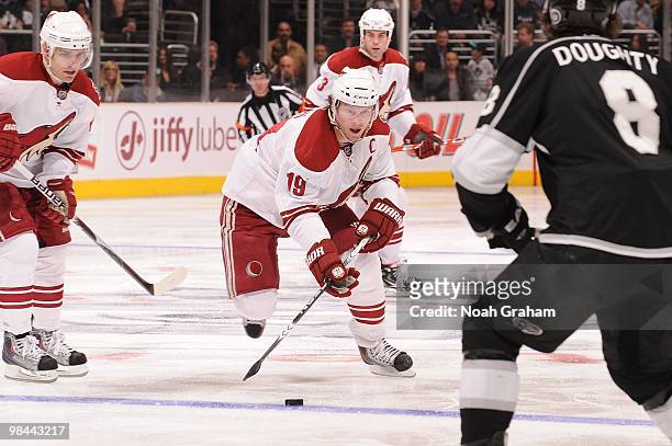 Shane Doan of the Phoenix Coyotes skates with the puck against Drew Doughty of the Los Angeles Kings on April 8, 2010 at Staples Center in Los...
