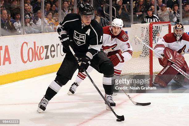 Anze Kopitar of the Los Angeles Kings skates with the puck against Keith Yandle of the Phoenix Coyotes on April 8, 2010 at Staples Center in Los...