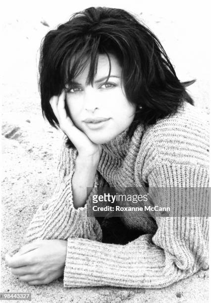 Actress Lisa Rinna poses for a portrait on at the beach on June 1, 1996 in Malibu, California.