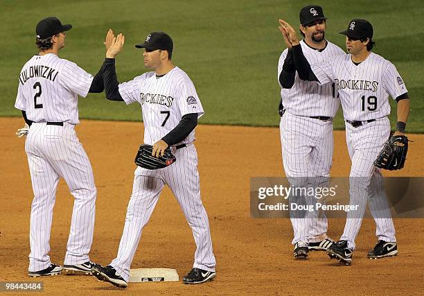 Troy Tulowitzki, Seth Smith, Todd Helton and Ryan Spilborghs of the Colorado Rockies celebrate after defeating the New York Mets during Major League...