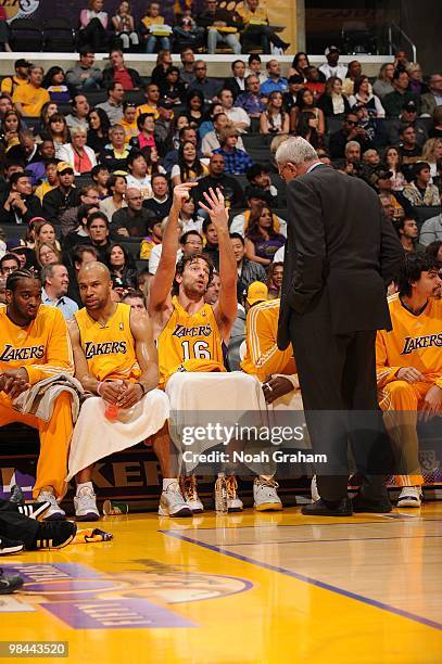 Pau Gasol of the Los Angeles Lakers and Head Coach Phil Jackson discuss a play on the bench during a game against the Sacramento Kings at Staples...