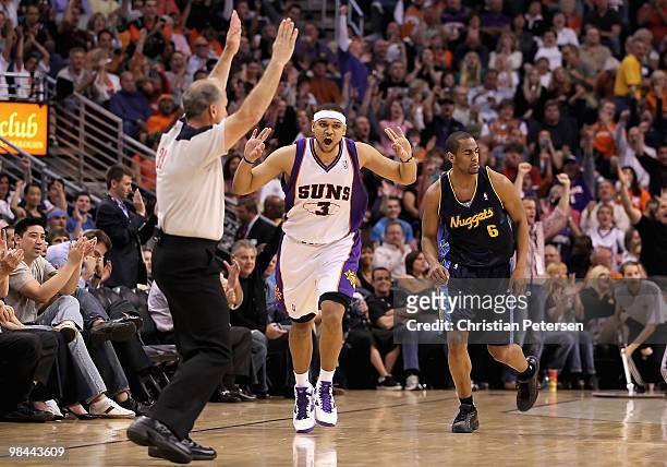 Jared Dudley of the Phoenix Suns reacts after hitting a three point shot over Arron Afflalo of the Denver Nuggets during the NBA game at US Airways...