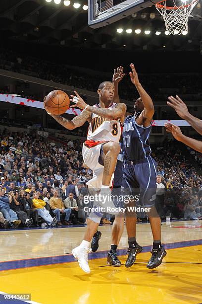 Monta Ellis of the Golden State Warriors drives baseline for the pass against Ronnie Price of the Utah Jazz on April 13, 2010 at Oracle Arena in...