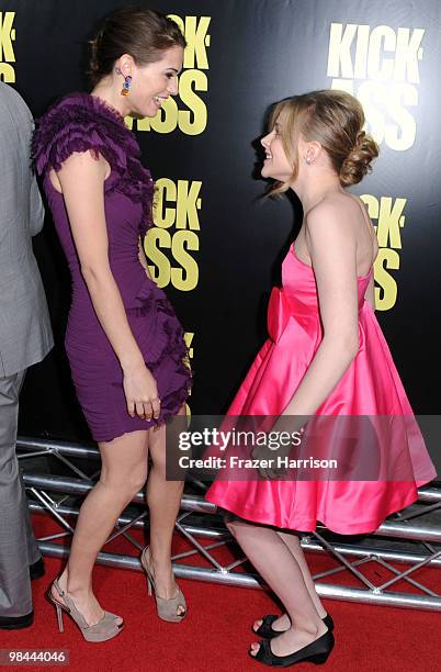 Actress Lyndsy Fonseca greets Chloe Moretz, actress at the 'Kick-Ass' premiere held at ArcLight Hollywood on April 13, 2010 in Hollywood, California.