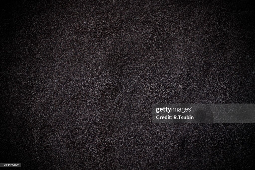 Dark edged wall asphalt texture background