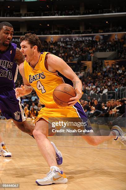 Luke Walton of the Los Angeles Lakers goes hard to the basket against Donte Greene of the Sacramento Kings at Staples Center on April 13, 2010 in Los...