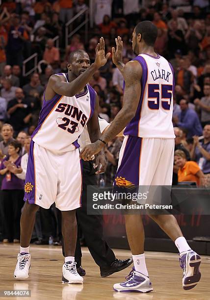 Jason Richardson of the Phoenix Suns high-fives teammate Earl Clark after scoring against the Denver Nuggets during the NBA game at US Airways Center...