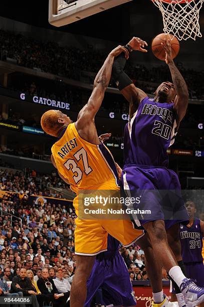 Donte Greene of the Sacramento Kings has his shot challenged by Ron Artest of the Los Angeles Lakers at Staples Center on April 13, 2010 in Los...