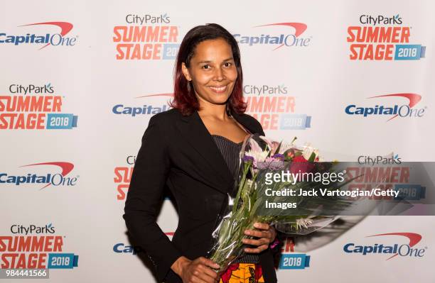 Folk and country singer and multi-instrumentalist Rhiannon Giddens poses backstage after performing at Central Park SummerStage, New York, New York,...