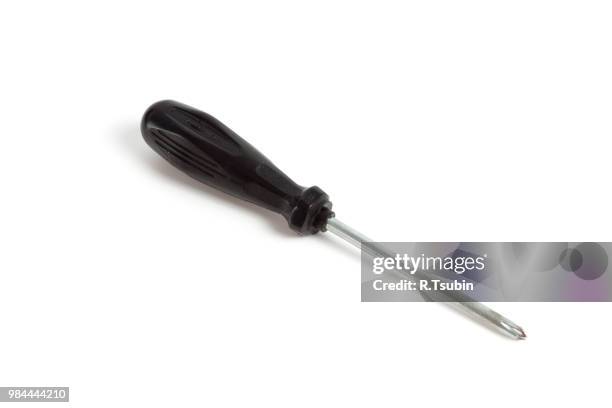 black screwdriver on white background - screwdriver stock pictures, royalty-free photos & images