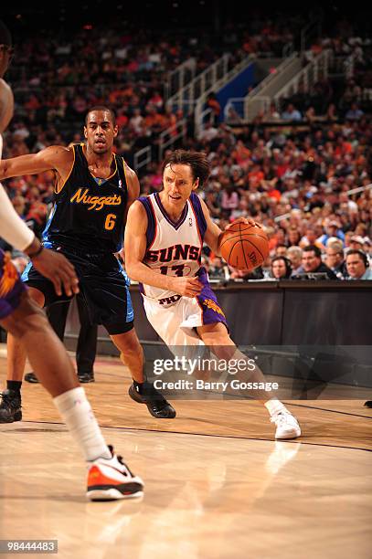 Steve Nash of the Phoenix Suns drives against the Arron Afflalo of the Denver Nuggets in an NBA Game played on April 13, 2010 at U.S. Airways Center...