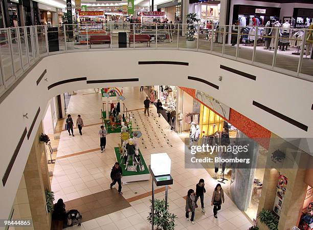 Shoppers walk through the Aeon Lake Town shopping mall in Koshigaya City, Saitama Prefecture, Japan, on Wednesday, April 14, 2010. Aeon Co., Japan's...
