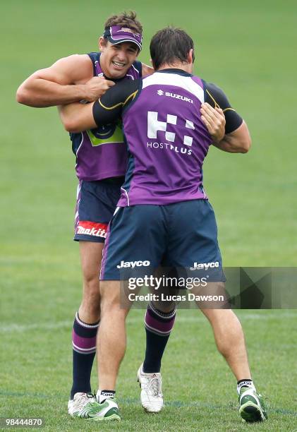 Billy Slater wrestles with Cooper Cronk during a Melbourne Storm NRL training session at Visy Park on April 14, 2010 in Melbourne, Australia.