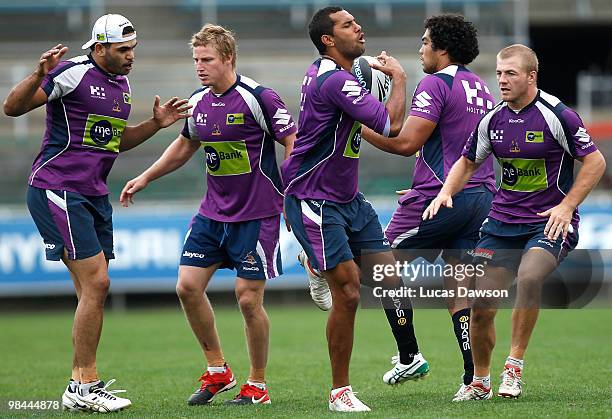 Storm players compete for the ball during a Melbourne Storm NRL training session at Visy Park on April 14, 2010 in Melbourne, Australia.