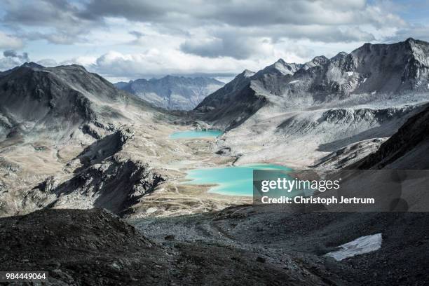 a lake in the canton of graubunden, switzerland. - graubunden canton stock pictures, royalty-free photos & images