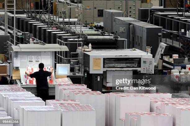 An employee of Anton Group Printers lays out a finished printed sheet in one of the first processes of printing Labour Party election material on...