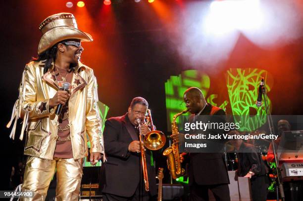 American r&b and funk musician Bootsy Collins performs with Fred Wesley on trombone, Maceo Parker on alto saxophone, and conductor Paul Shaffer at...