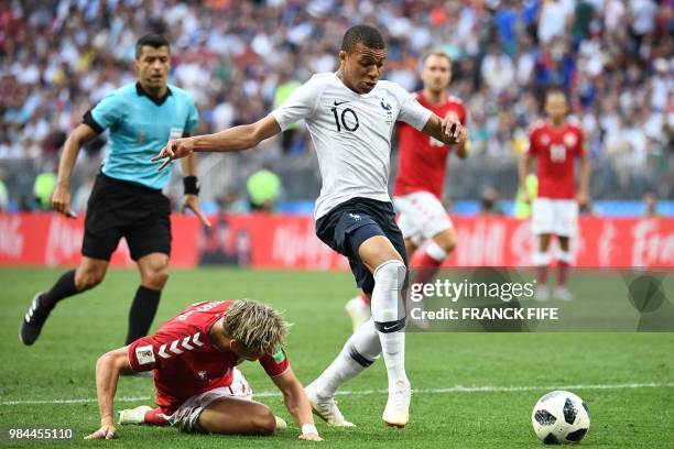 France's forward Kylian Mbappe vies with Denmark's defender Jens Stryger Larsen during the Russia 2018 World Cup Group C football match between...