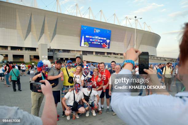 Iceland and Croatia fans pose for a picture as they arrive to attend the Russia 2018 World Cup Group D football match between Iceland and Croatia at...