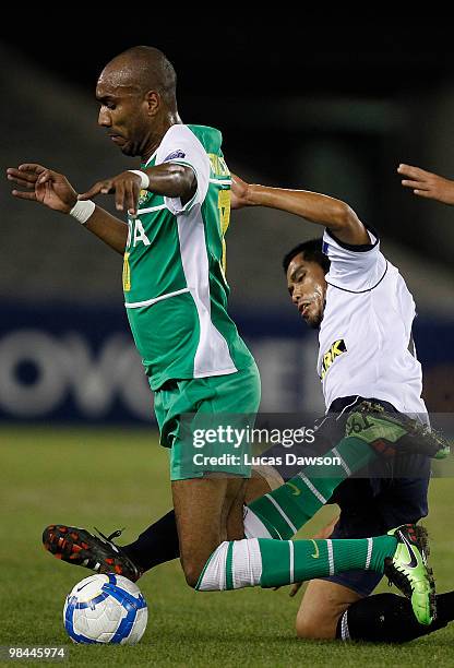 Erivaldo Saraiva of Beijing is challenged by Surat Sukha of the Victory during the AFC Champions League group E match between Melbourne Victory and...