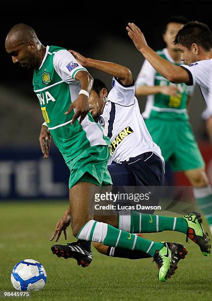 Erivaldo Saraiva of Beijing is challenged by Surat Sukha of the Victory during the AFC Champions League group E match between Melbourne Victory and...