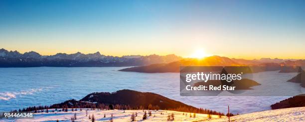 sunset over julian alps - villach stock pictures, royalty-free photos & images