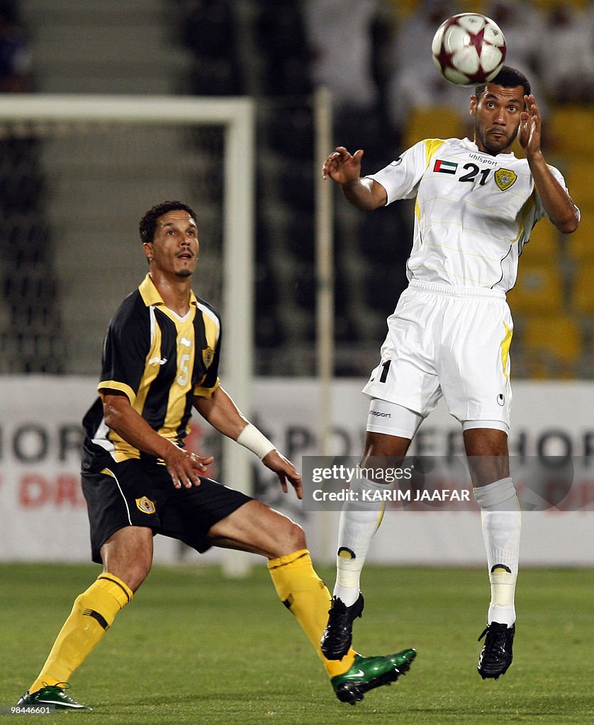 UAE's Al-Wasl club player Said al-Kas (R