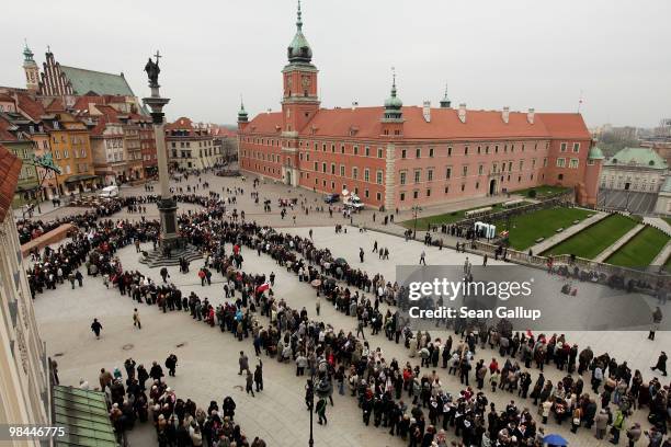 Mourners wait in a snaking line to pay their last respects at the coffins of late Polish President Lech Kaczynski and his wife Maria that were lying...