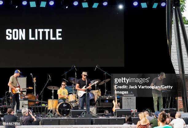 American blues and rhythm & blues singer-songwriter Son Little performs with his band with Pat Finnerty on guitar, Jesse Maynard on drums, and...