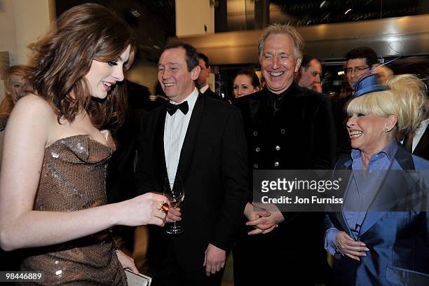 Actors Anne Hathaway, Paul Whitehouse, Alan Rickman and Barbara Windsor share a joke as they attend the Royal World Premiere of Tim Burton's 'Alice...