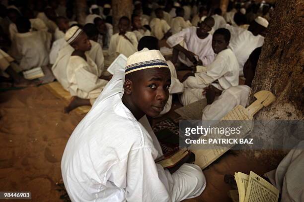 Sudanese Sufi students recite verses of the Koran at the Qadiriya Badiriya Sufi mosque in the village of Umm Dawban, 40kms north of Khartoum, on...