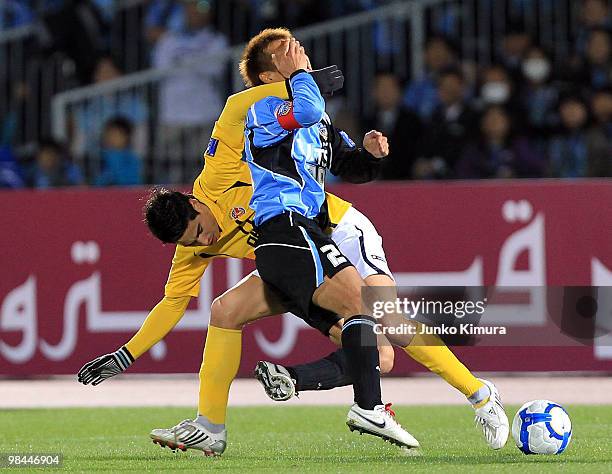 Hiroyuki Taniguchi of Kawasaki Frontale and Molina of Seongnam Ilhwa compete for the ball during the AFC Champions League match between Kawasaki...