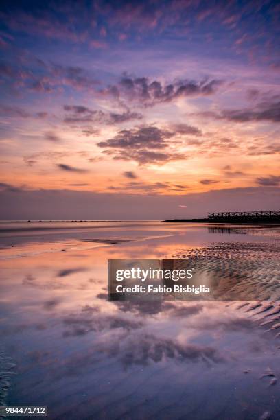 spiaggia al tramonto - beach at sunset - spiaggia stock pictures, royalty-free photos & images