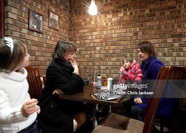 Esther Rantzen listens to the problems of a local lady in a cafe as she campaigns as an independant candidate for Luton South on April 14, 2010 in...