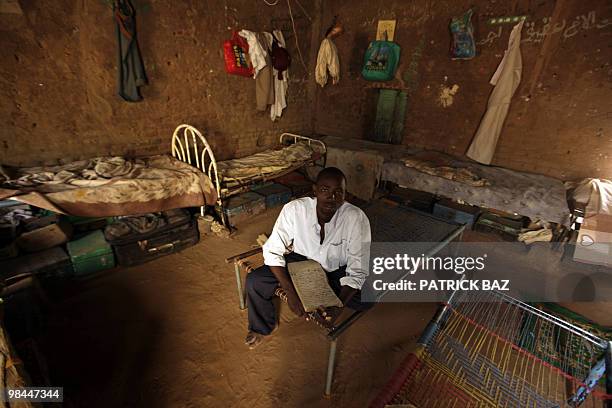 Sudanese Sufi student sits in the dorm of the Qadiriya Sufi school in the village of Umm Dawban, 40 kms north of Khartoum, on April 13, 2010. In the...