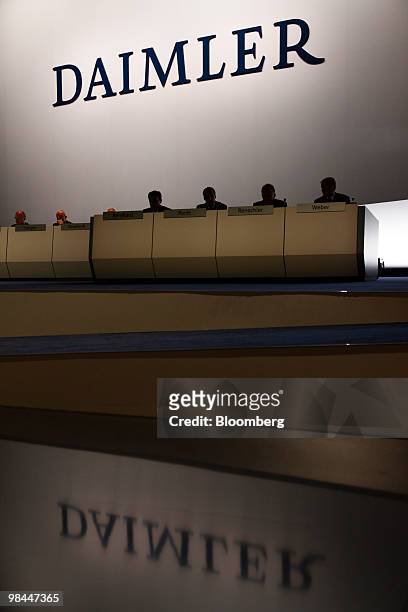 The Daimler AG logo is seen above company executives at the company's annual shareholder's meeting in Berlin, Germany, on Wednesday, April 14, 2010....