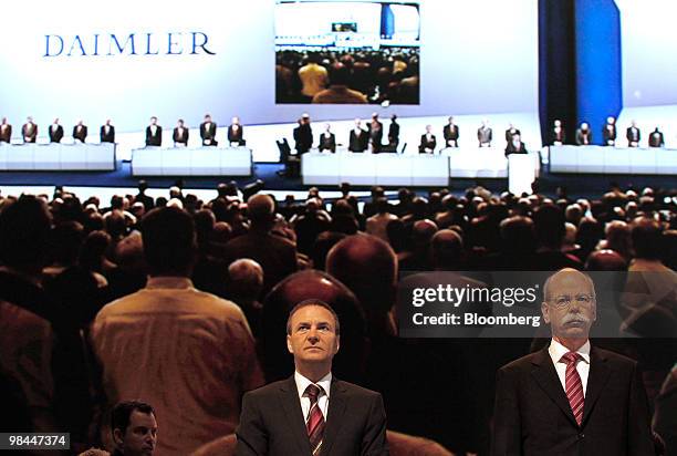 Bodo Uebber, chief financial officer of Daimler AG, left, and Dieter Zetsche, chief executive officer of Daimler AG, arrive for the company's annual...