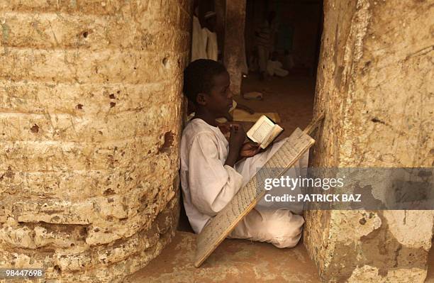 Sudanese Sufi student recites verses of the Koran at the Qadiriya Sufi school in the village of Umm Dawban, 40 kms north of Khartoum, on April 13,...