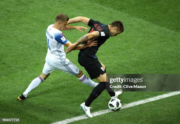 Duje Caleta-Car of Croatia is challenged by Alfred Finnbogason of Iceland during the 2018 FIFA World Cup Russia group D match between Iceland and...